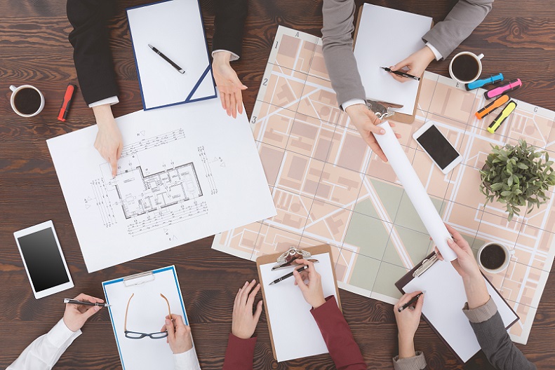 Workers of real estate agency analyzing architecture project, top view