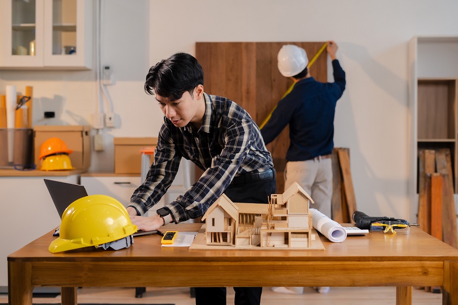 Team architect or engineer in office working on architects project.